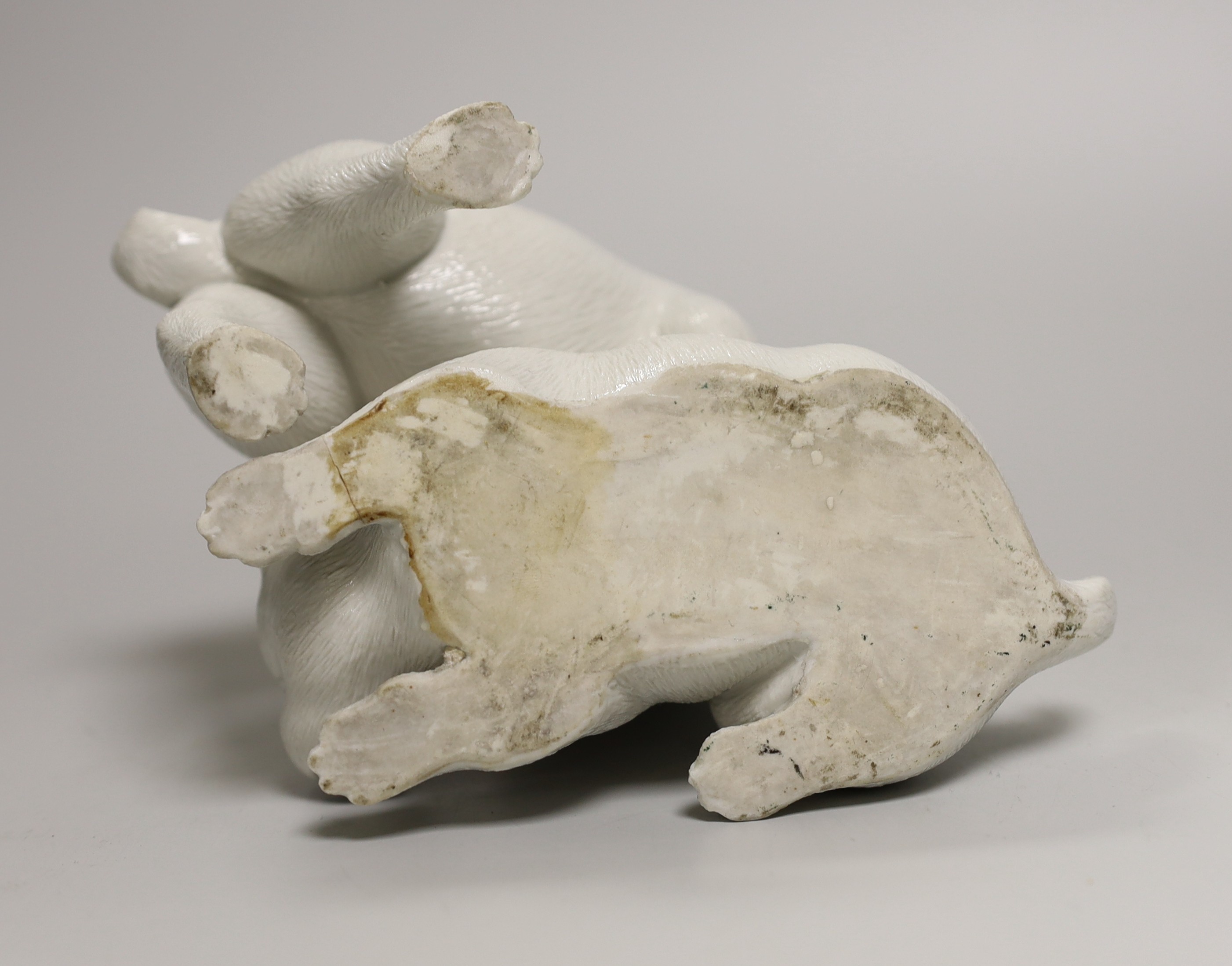 A Japanese Hirado white glazed model of two pugs, Meiji period, 17cm